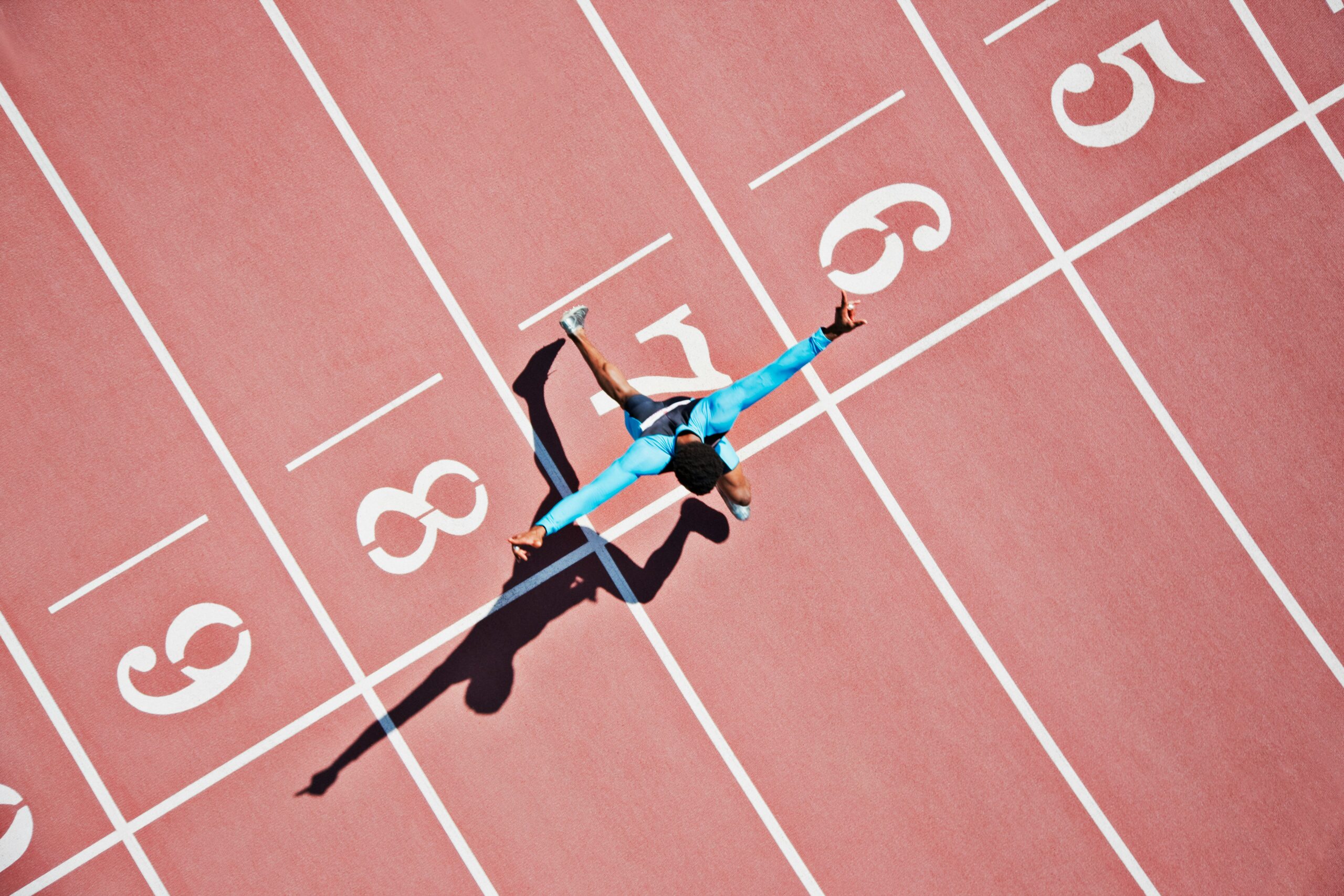 an athlete runs on a track